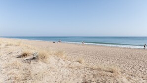 A sandy beach with a clear sky.