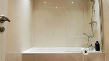 Combined shower/bathtub, hair dryer, towels, soap