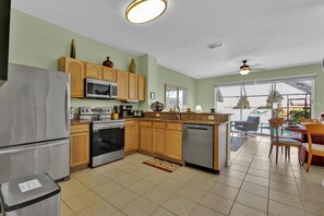 Enjoy cooking in this well-equipped kitchen with a refrigerator, stove, oven, and dishwasher.