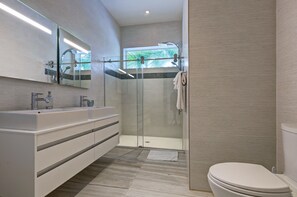 Shower, hair dryer, bathrobes, towels