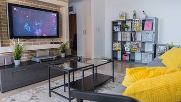 Panoramic Apartment | Living area | 50-inch LED TV with digital channels, TV