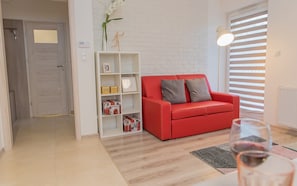 Deluxe Apartment | Living room | 42-inch LED TV with cable channels, TV
