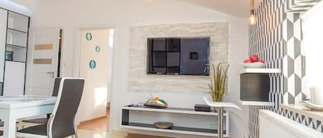Comfort Apartment | Living area | 50-inch flat-screen TV with digital channels, LED TV