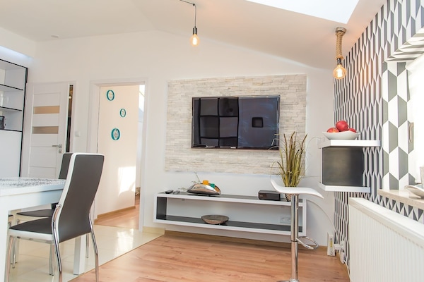 Comfort Apartment | Living area | 50-inch flat-screen TV with digital channels, LED TV