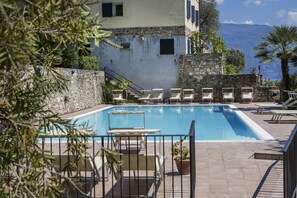Seasonal outdoor pool, open 9:00 AM to 9:00 PM, sun loungers