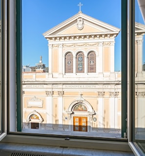 A building with classical architecture, featuring a central dome, arched windows, and a prominent entrance.