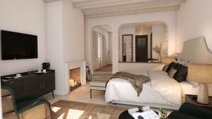 Una habitación de hotel moderna con cama, mesita de noche, lámpara y televisor.