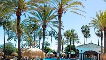 Seasonal outdoor pool, open 11:00 AM to 7:00 PM, pool umbrellas