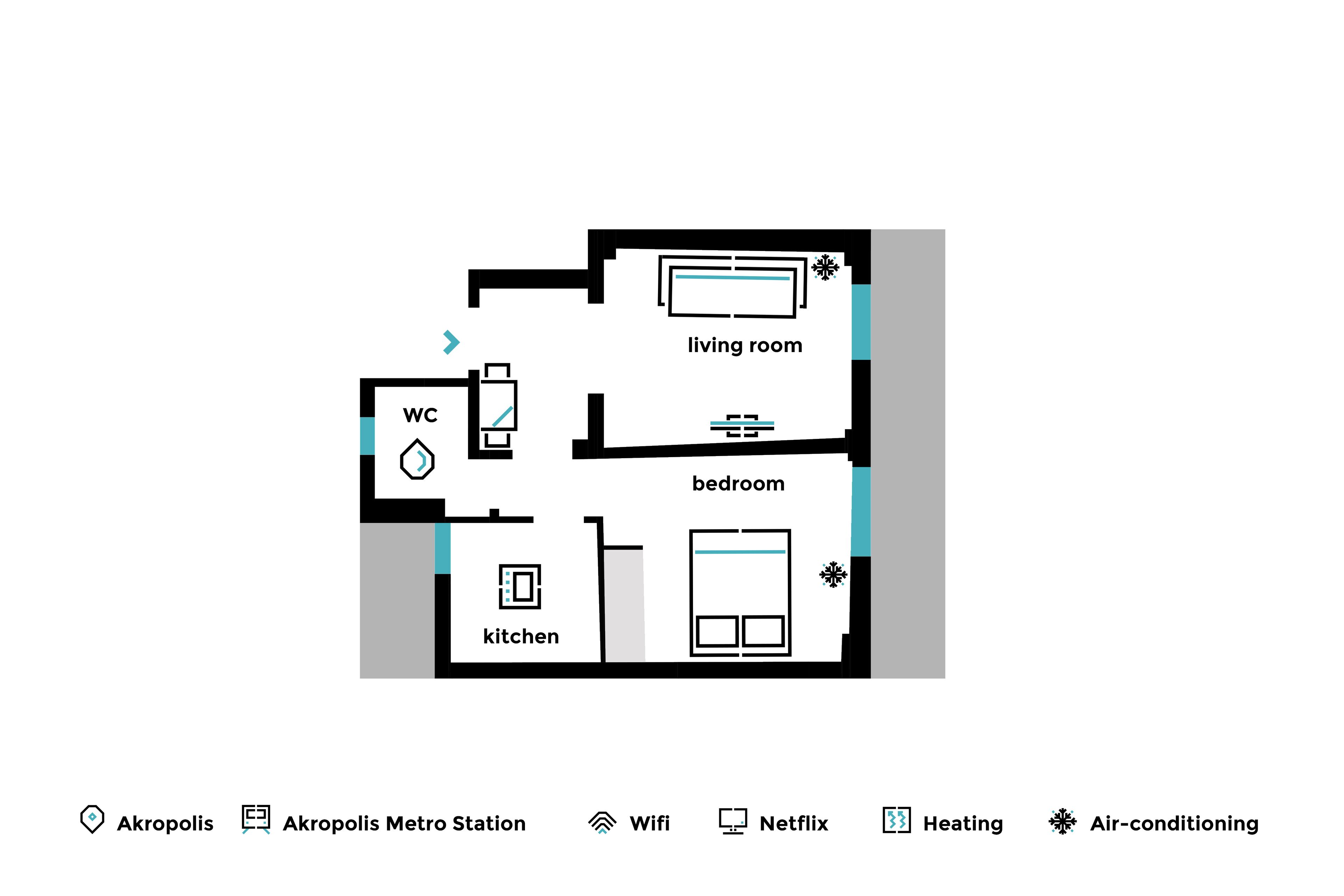 A floor plan of a hotel room with a living room, bedroom, kitchen, and WC.