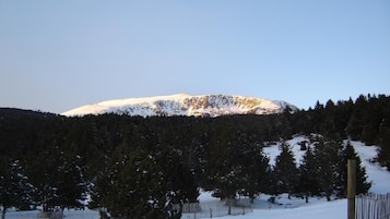 A snow-covered mountain with a clear sky.