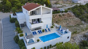 A modern two-story house with a swimming pool, multiple balconies, and a garden area. - Last-minute offers / Pet-friendly / VERY low low-season prices (Komarna)