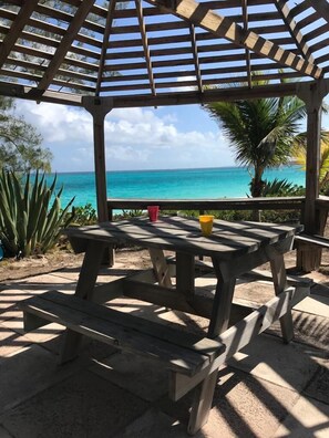 A wooden gazebo with a view of the ocean. - OceanWaves, A Vacation to Remember!A 1minute walk to private gazebo and beach. (Governor's Harbour)
