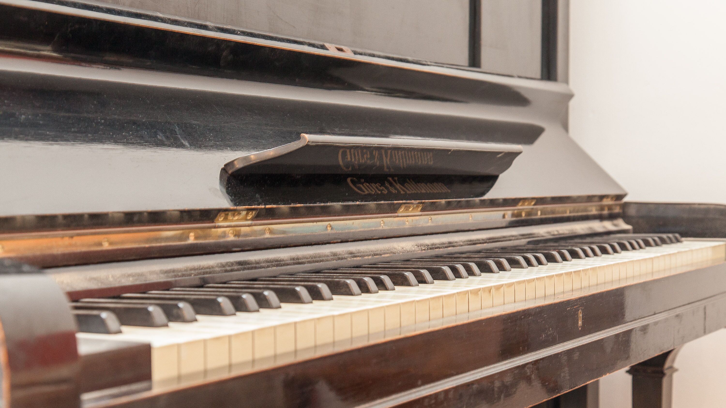 A close-up of a piano's keys and hammers.