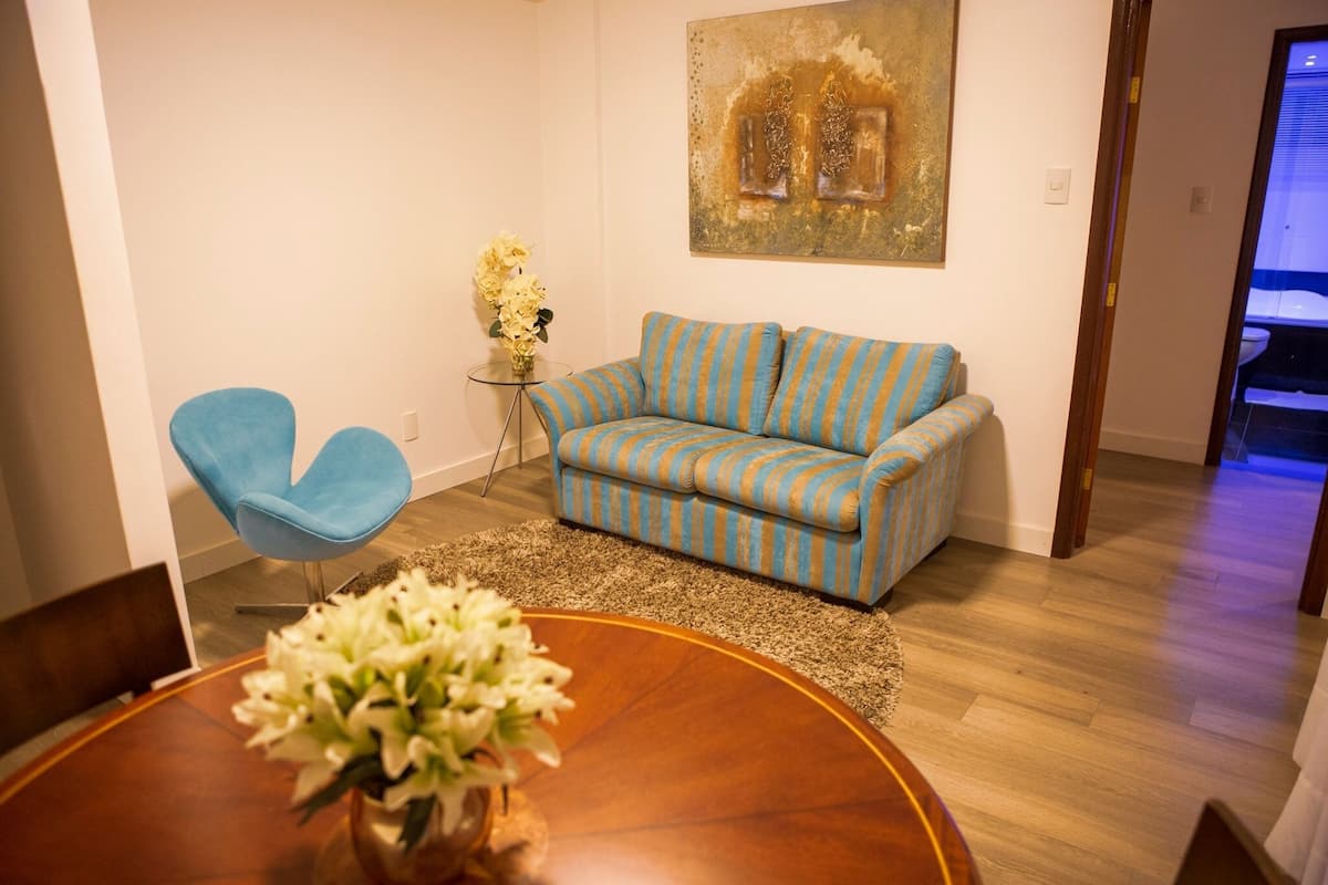 Romantic Studio Suite | Living area | Flat-screen TV