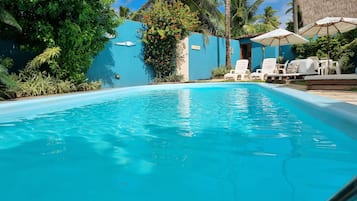 Outdoor pool, open 8:00 AM to 8:00 PM, pool umbrellas, pool loungers