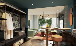 A modern kitchen with a dining area, a built-in wardrobe, and a view of the outdoors. - Mamaka Phuket, Tapestry Collection by Hilton (Choeng Thale)