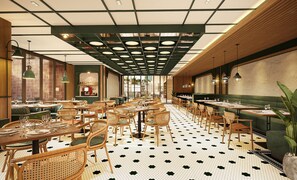 A restaurant interior with multiple dining tables and chairs, a patterned floor, and a ceiling with recessed lighting. - Mamaka Phuket, Tapestry Collection by Hilton (Choeng Thale)