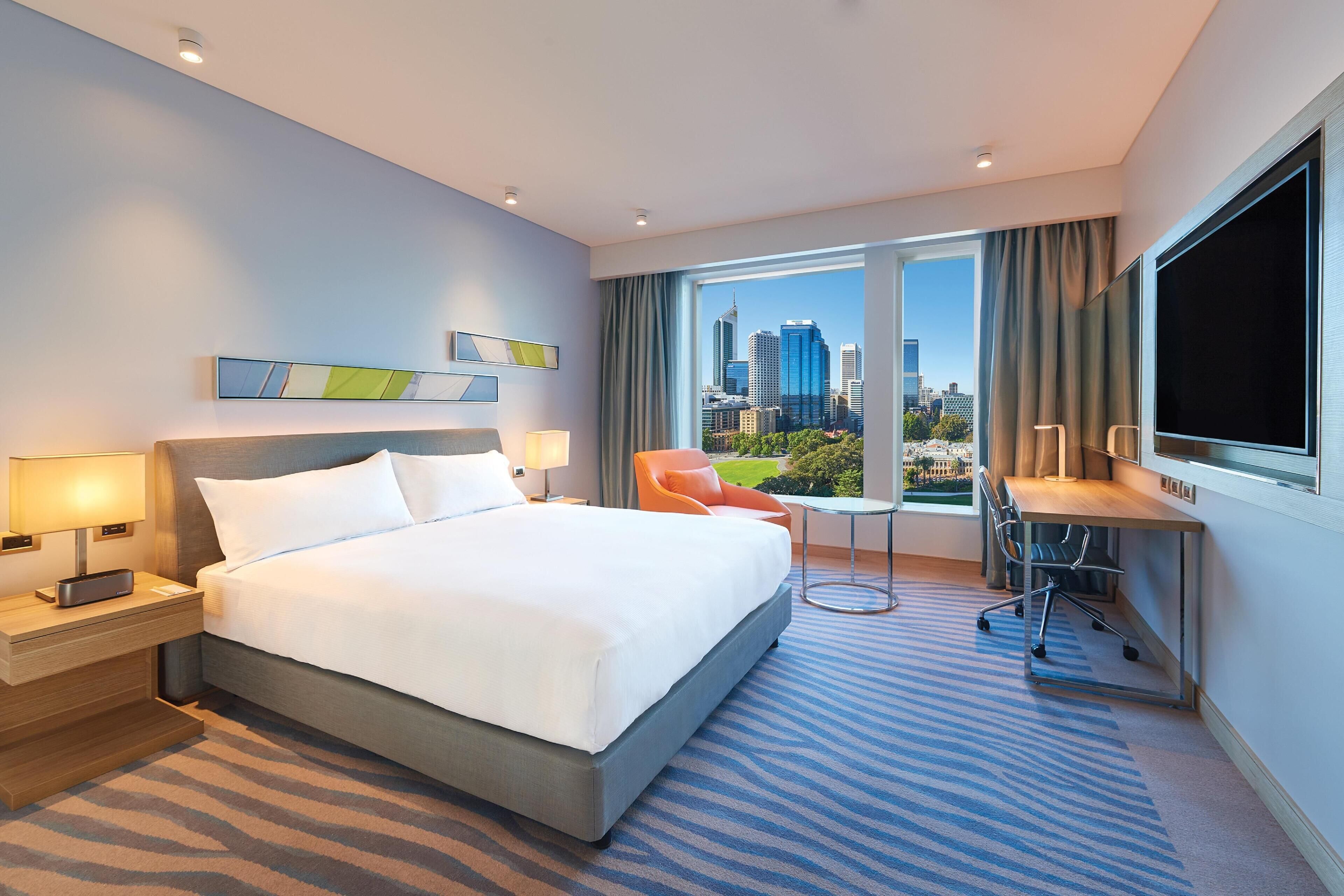 Room, 1 King Bed, City View | In-room safe, desk, laptop workspace, blackout drapes