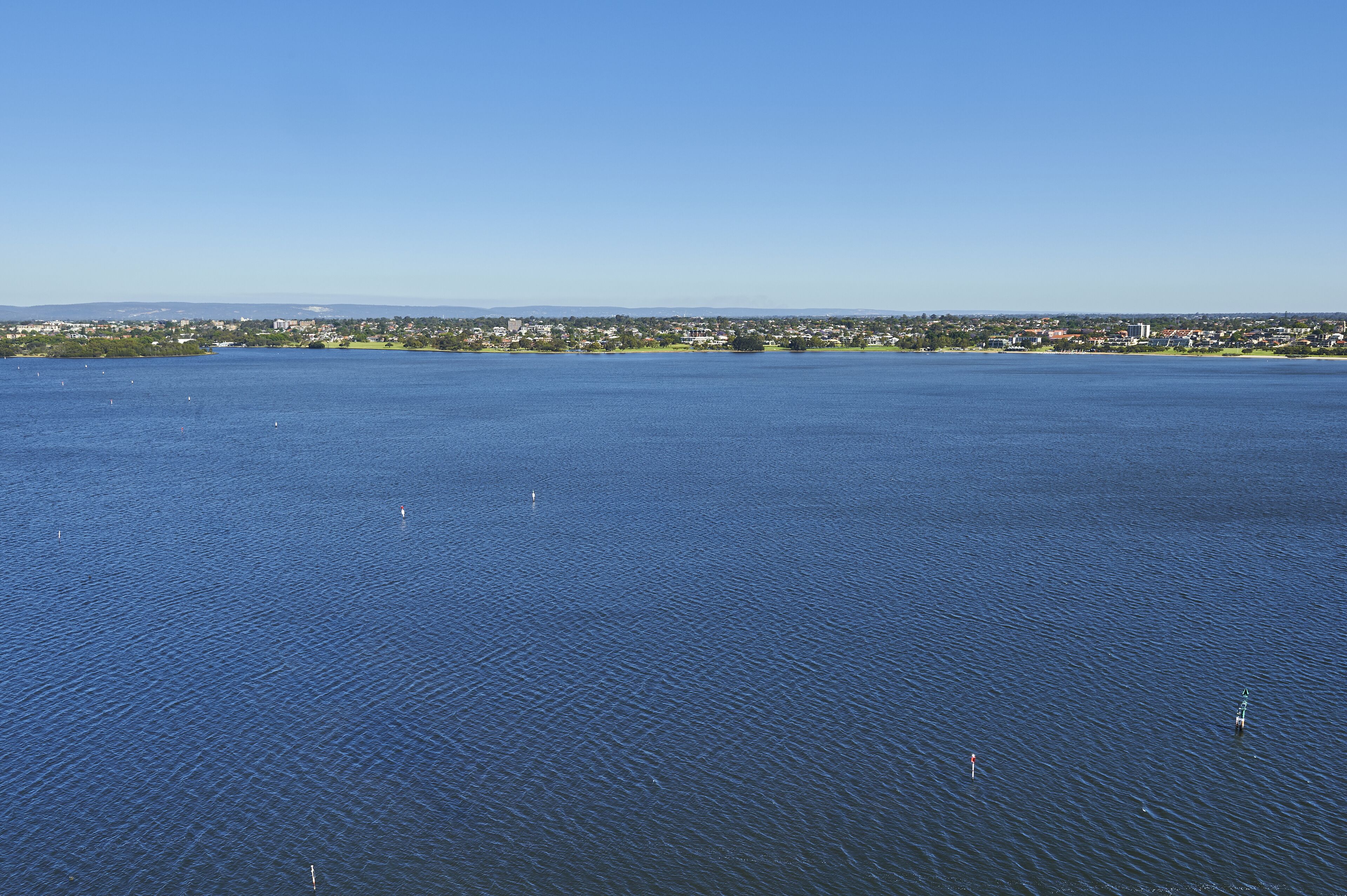 A large body of water with a distant shoreline.