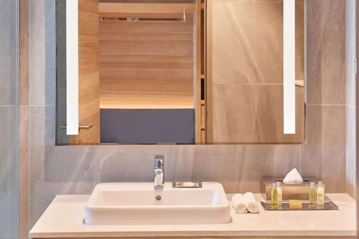Shower, designer toiletries, hair dryer, bathrobes