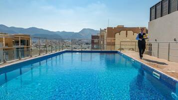 Indoor pool, pool umbrellas, sun loungers