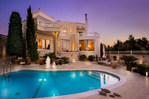 Outdoor pool, a heated pool, sun loungers