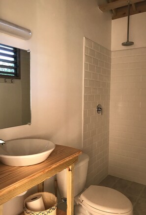 Shower, towels, soap, toilet paper - Apartment in a Modern Container Conversion (Brandon Hill, Montego Bay)