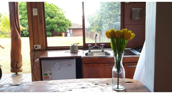 Fridge, electric kettle, cookware/dishes/utensils