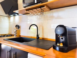 Fridge, microwave, stovetop, coffee/tea maker