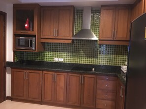 Fridge, microwave, stovetop, coffee/tea maker