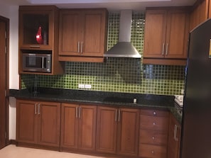 Fridge, microwave, stovetop, coffee/tea maker
