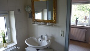 Combined shower/tub, hair dryer, towels, soap