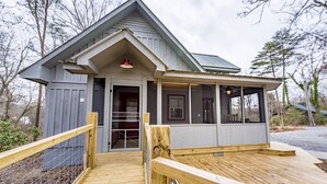 A small, single-story building with a porch and a wooden deck. - Handicap Accessible cottage at Desoto Falls Mentone, AL  Central Time Zone (Mentone)