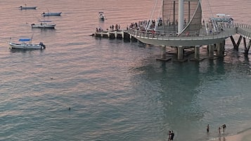 On the beach, sun loungers, beach towels
