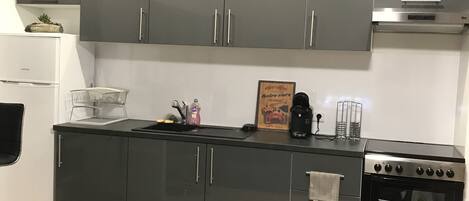 Fridge, coffee/tea maker, cookware/dishes/utensils