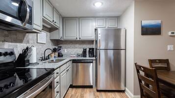 Coffee/tea maker, microwave, dishwasher, cookware/dishes/utensils