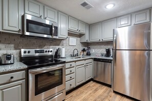 Microwave, dishwasher, coffee/tea maker, cookware/dishes/utensils