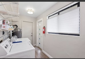 Convenient laundry facilities with a washing machine and dryer.