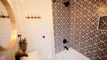 Combined shower/bathtub, hair dryer, towels, soap