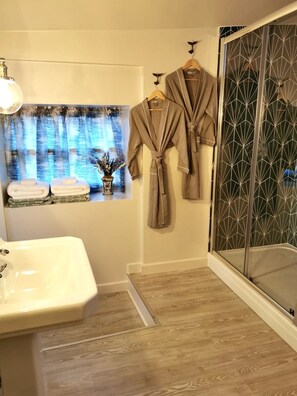 Hair dryer, bathrobes, towels, soap