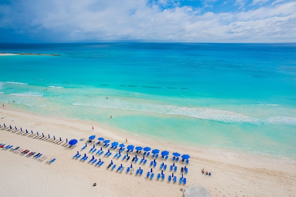 On the beach, sun loungers, beach towels