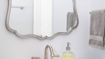 Combined shower/tub, hair dryer, towels, soap