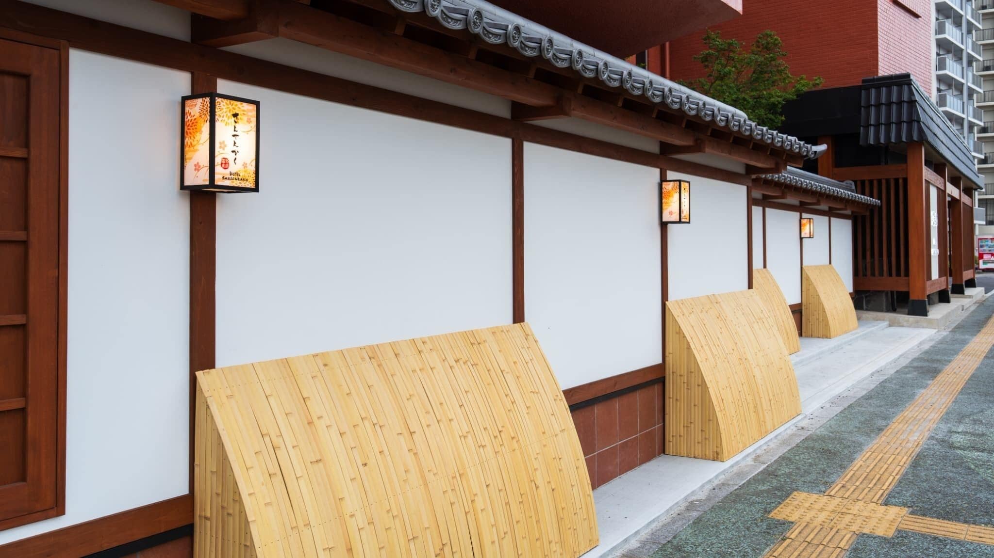 A row of traditional Japanese-style rooms with tatami mats and shoji screens.
