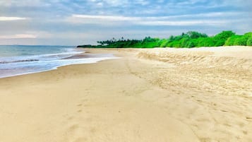 Beach nearby, white sand, beach towels
