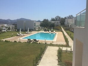 Outdoor pool, pool umbrellas, pool loungers