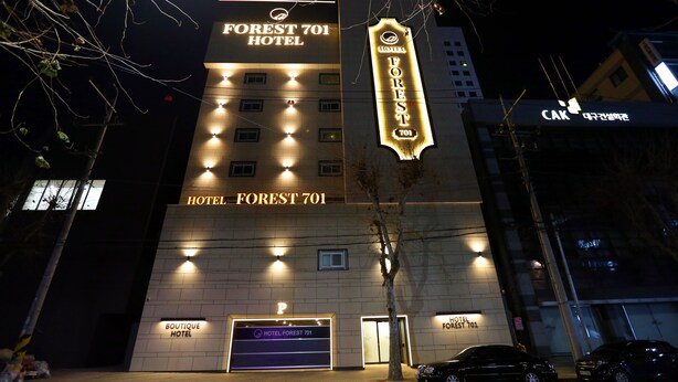 A hotel with a prominent sign reading "FOREST 701 HOTEL" and a parking area labeled "P". - Forest 701 Hotel (Daegu)