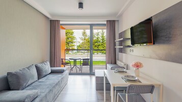 Apartment (B005) | Living area | Flat-screen TV