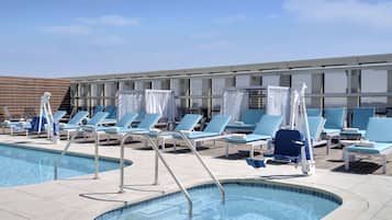 Outdoor pool, open 6:00 AM to 10:00 PM, free cabanas, sun loungers