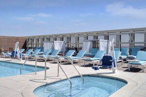 Outdoor pool, open 6:00 AM to 10:00 PM, free cabanas, sun loungers