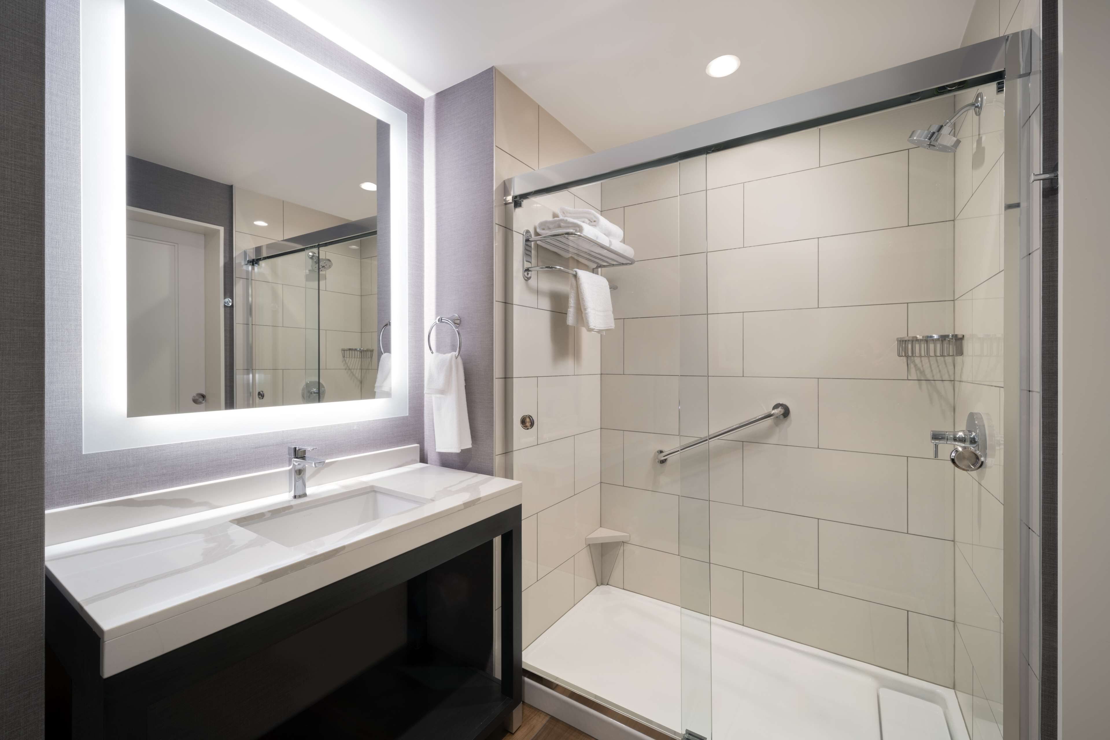 designer toiletries, hair dryer, towels, soap